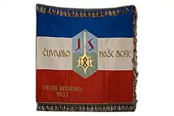 Blue-white-red tricolour with Jadranska straža seal