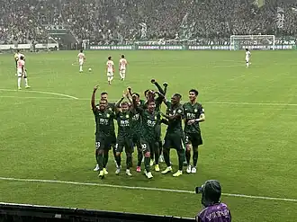 Captain Zhang Xizhe and teammates celebrating his goal against Changchun Yatai on 14 June