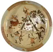 Japanese Mino ware (stoneware) plate decorated with an image of rats attacking cats after Kawanabe Kyousai (1831-1899)