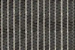 Biogrowth between the fins of an uncleaned air conditioner evaporator.