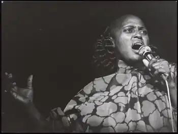 A black and white image of Miriam Makeba performing in 1978